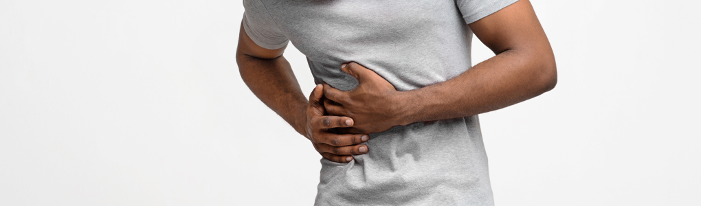 Hernia header of a guy holding his side